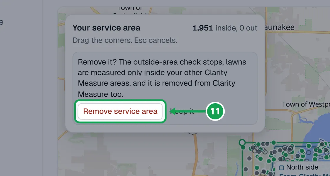 Step 11: Read the warning: the outside-area check stops, lawns anywhere get measured, and the area is removed from Clarity Measure too. Press Remove service area to confirm, or Keep it. The part to press is outlined in green.